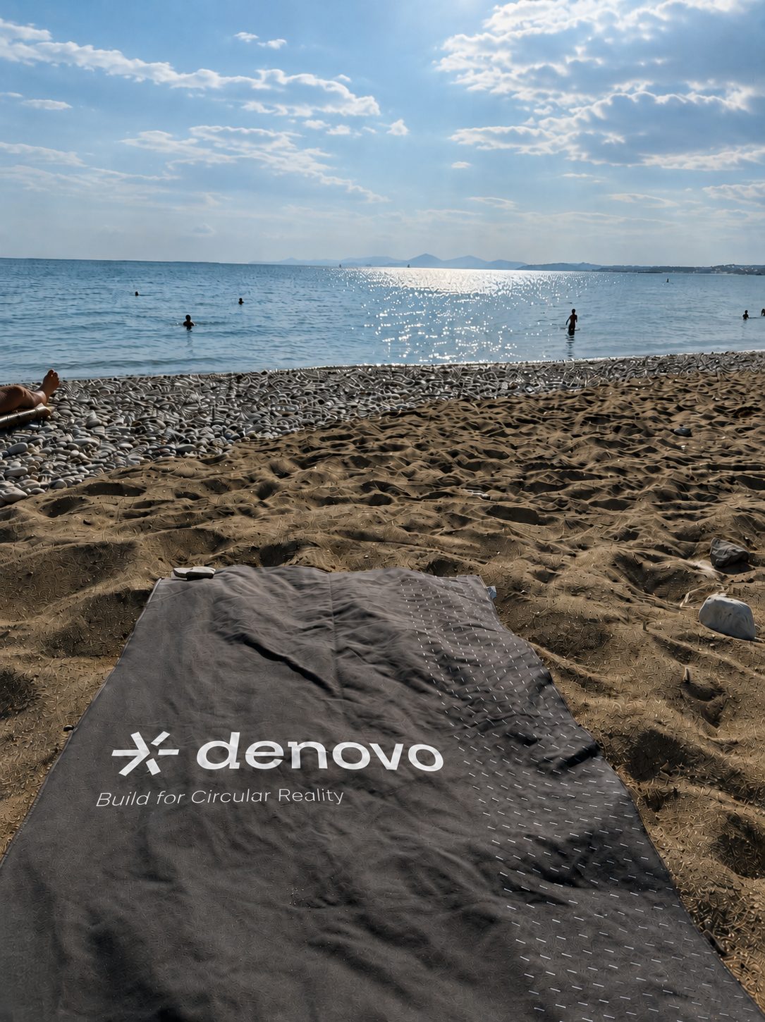 Denovo towel on the beach during a workation